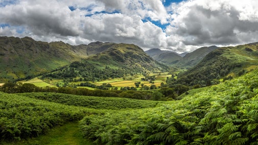 View of Thorneythwaite farm in the Seathwaite valley in Borrowdale on a summers day